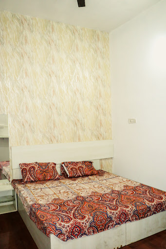 Deluxe AC Room with decorative wallpaper